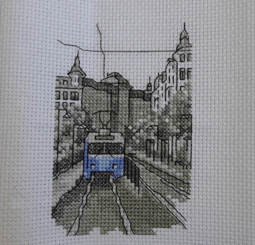 An actually completed cross stitch project of a Gothenburg tram