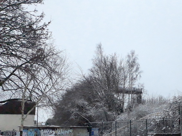 Snowy railway embankment