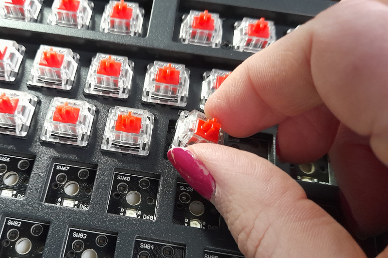 Plugging switches into the keyboard.  If I'd been planning to blog about this I'd have done my nails first