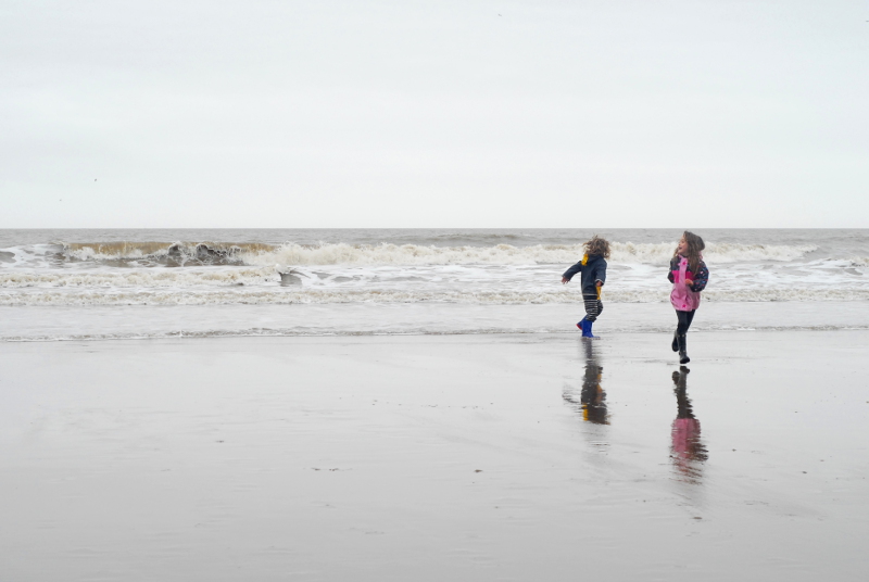 Running about on the beach