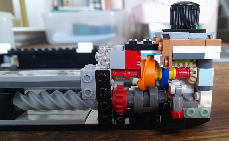 A compact Lego mechanism consisting of a small number of gears and cams