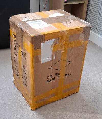 A big cardboard box A big cardboard box, sitting on the carpet