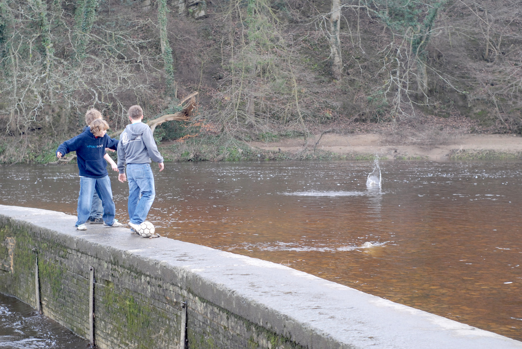 Boys throwing stones